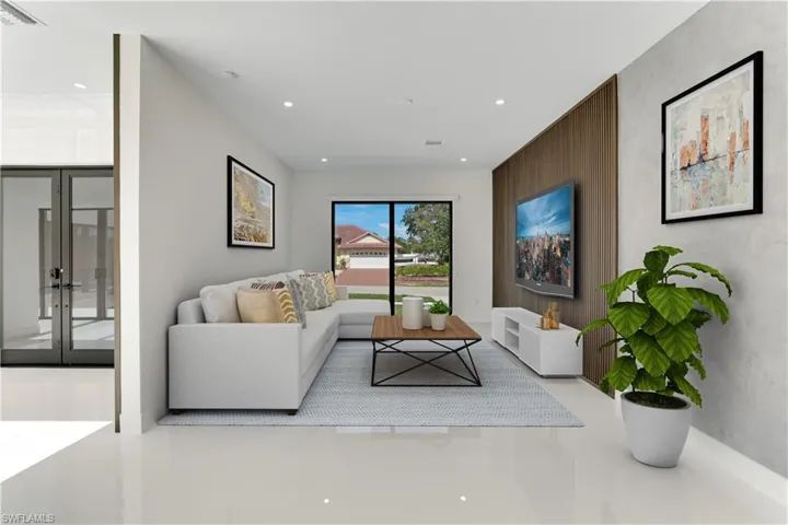 Living area featuring recessed lighting, visible vents, and french doors