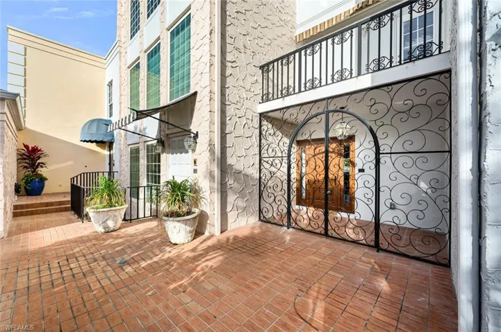 Doorway to property featuring a patio area