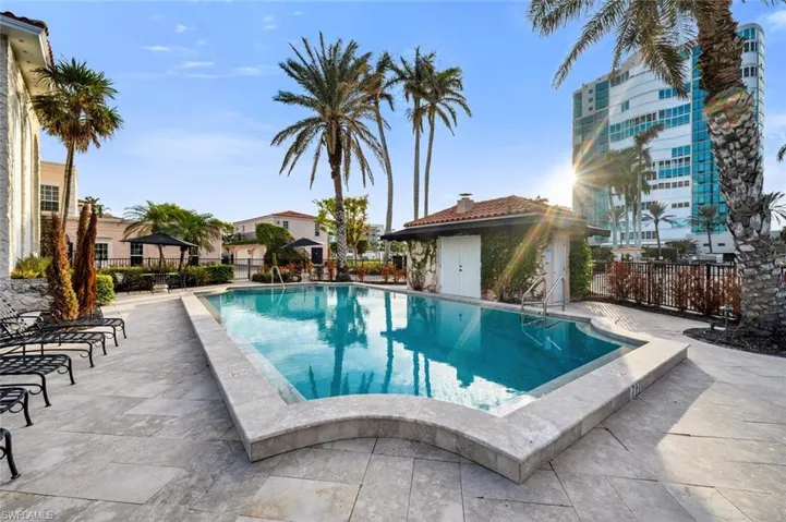 Community pool featuring a patio