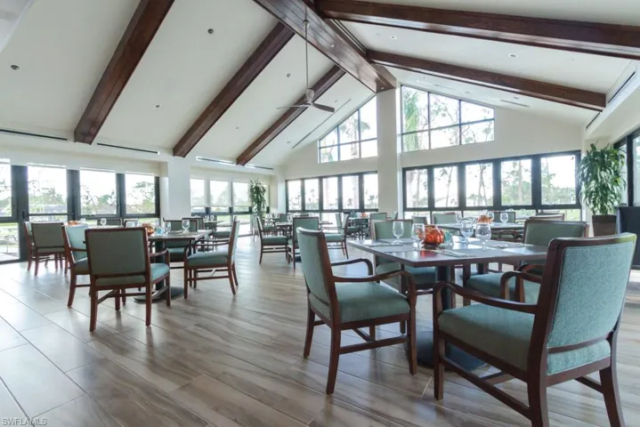 Dining room with ceiling fan, high vaulted ceiling, and beamed ceiling