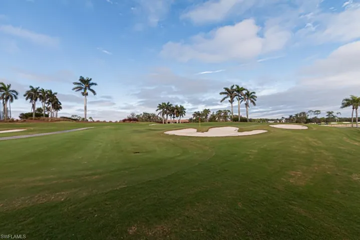 View of property's community with a yard