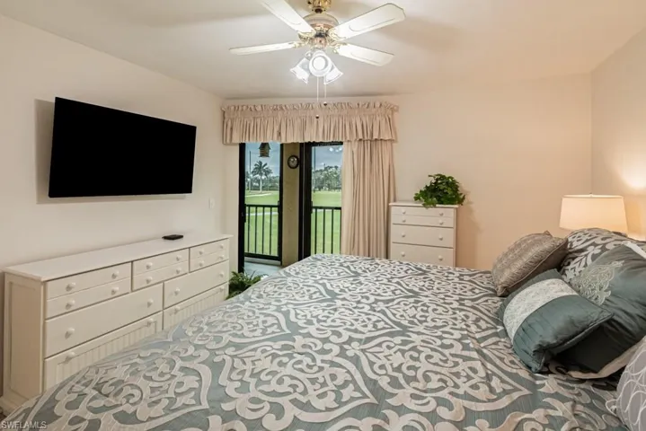 Bedroom with ceiling fan and access to exterior