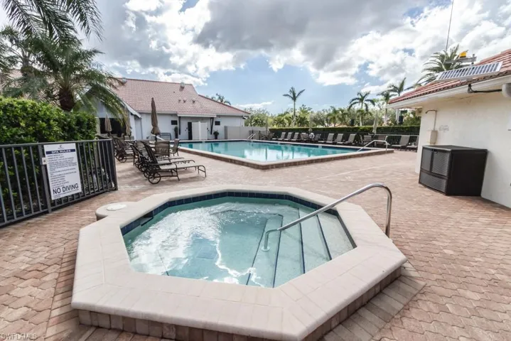 View of pool featuring a community hot tub