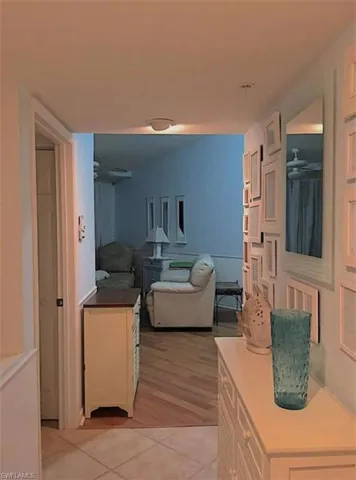 Hall with light hardwood / wood-style floors