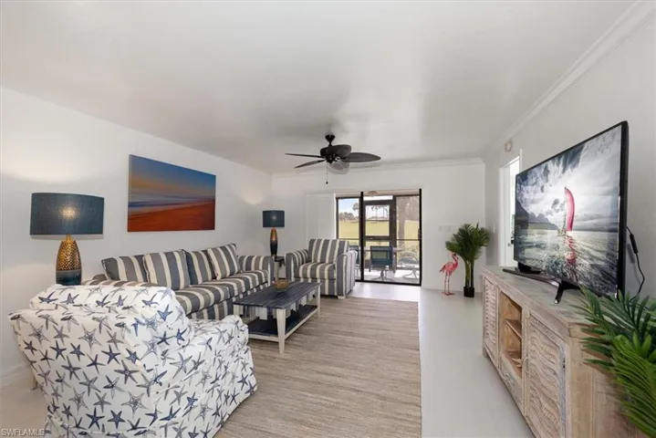 Living room featuring ceiling fan