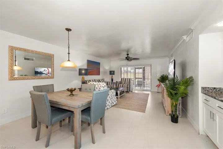 Dining area with ceiling fan and baseboards