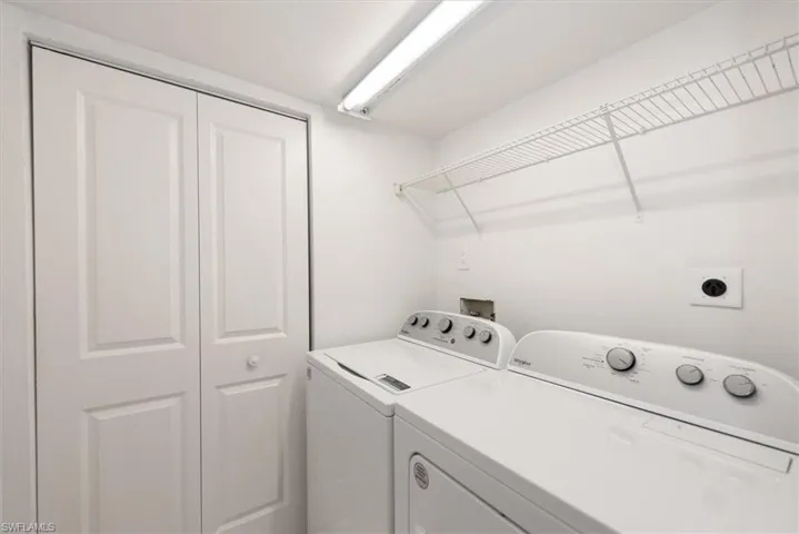 Laundry room featuring separate washer and dryer