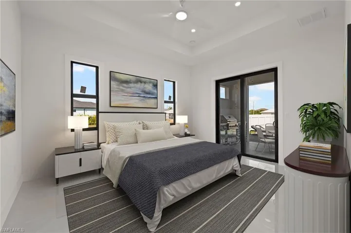 Bedroom with visible vents, a raised ceiling, ceiling fan, access to exterior, and recessed lighting