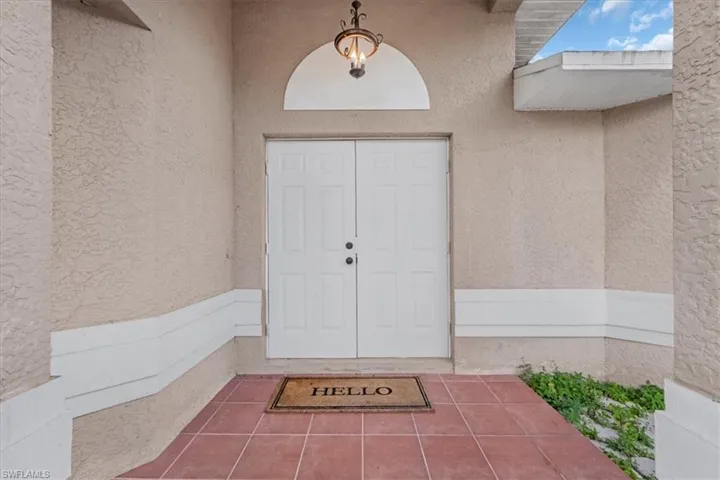 Property entrance with stucco siding