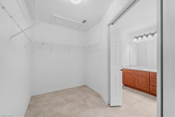 Walk in closet with attic access