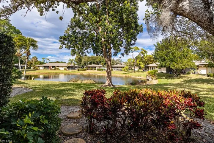 View of green lawn with a water view and great for bird watching!