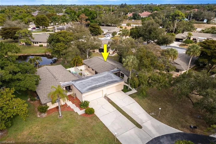 Aerial overview of property's location with a nearby body of water and nearby suburban area