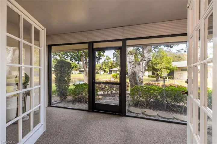 Doorway to outside with a water view