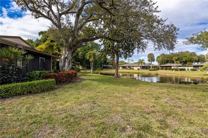 View of grassy yard featuring a water view