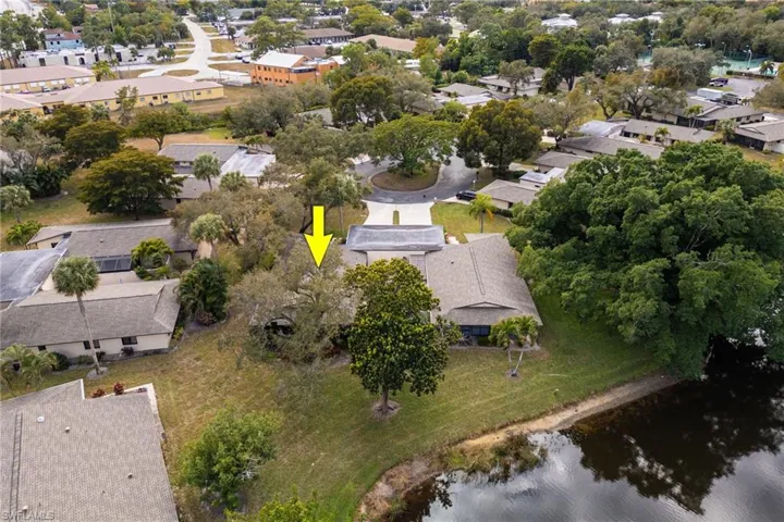 Aerial overview of property's location with nearby suburban area and a large body of water