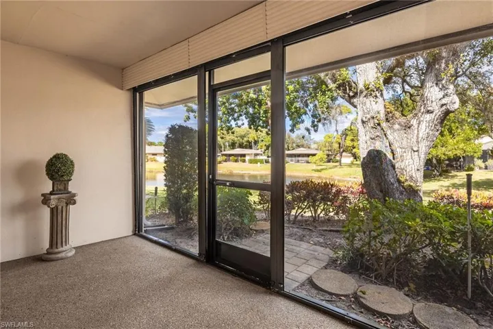 Unfurnished sunroom with a water view