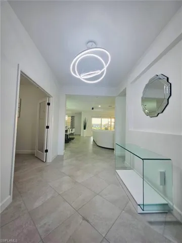 Hall featuring baseboards