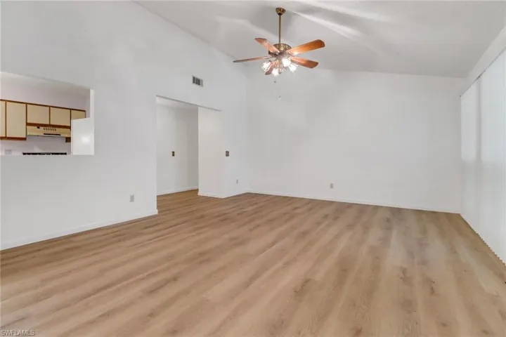 Living room featuring ceiling fan, light hardwood / wood-style flooring