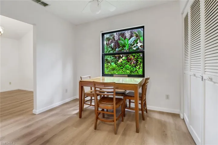 Dining room featuring ceiling fan and light hardwood / wood-style floors