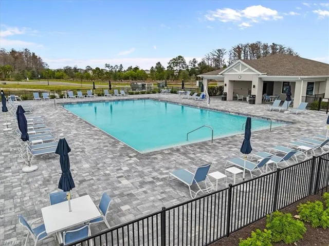 Community pool featuring a patio