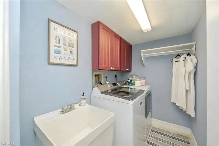 Laundry area featuring a sink and washer and dryer