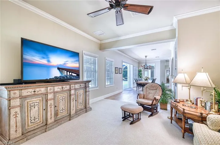 Family Room, Crown molding and ceiling fan.