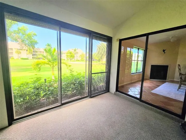 Glass Enclosed Lanai w/Sliders to Yard & Den
