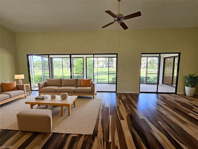 VIRTUALLY STAGED Great Room w/Scandinavian Furniture & Brazilian Pecan Flooring facing Lanai & Golf Course - View 1