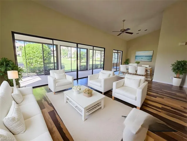 VIRTUALLY STAGED Great Room w/White Modern Furniture & Brazilian Pecan Flooring facing Lanai & Golf Course - View 4