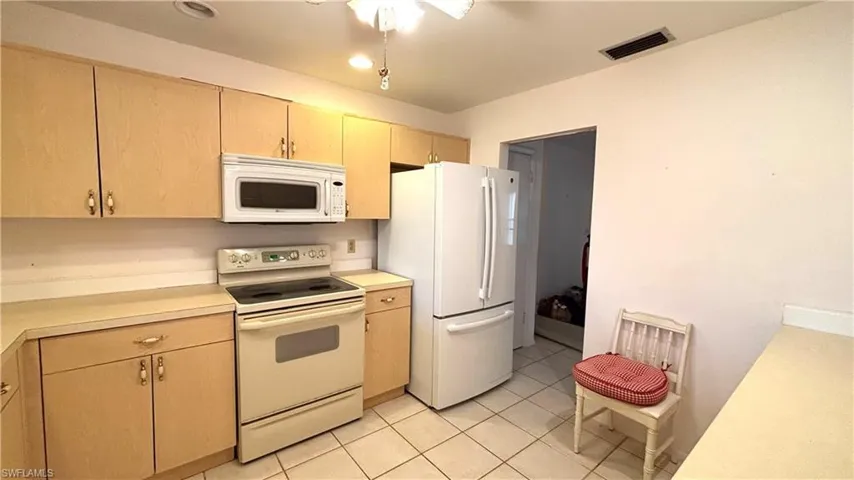 The Kitchen features a Dishwasher, Smooth-top Stove, MW, and Fridge