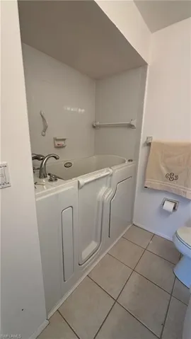 Walk-in tub in the Primary bathroom.