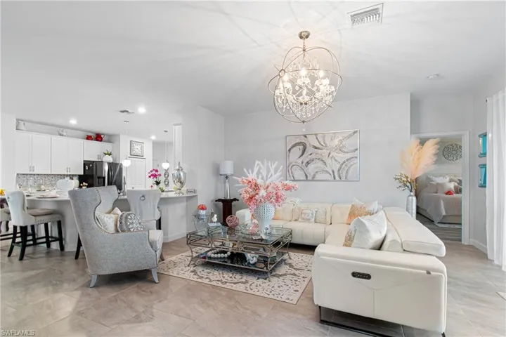 Living area featuring a chandelier and recessed lighting