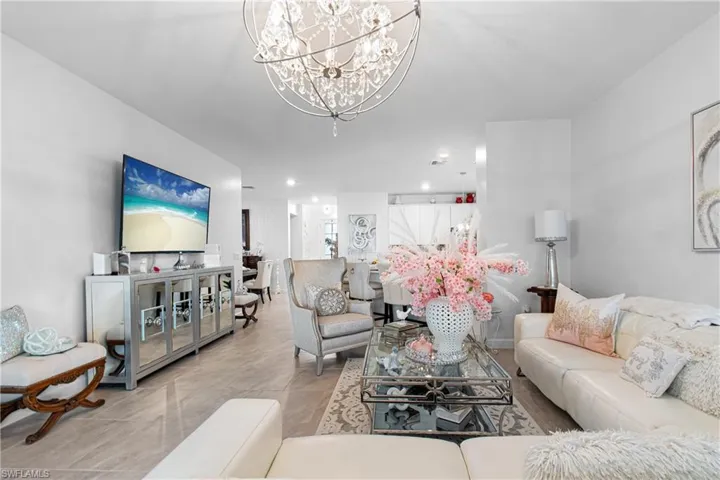 Living room featuring a chandelier
