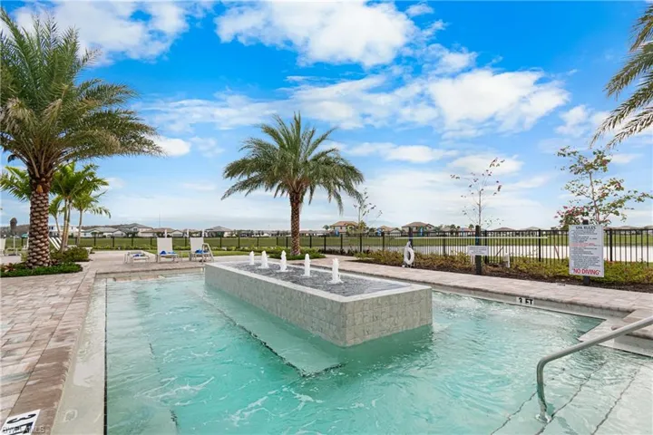 Community pool featuring a residential view