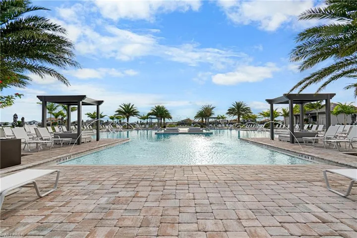 Community pool featuring a patio area and a jacuzzi