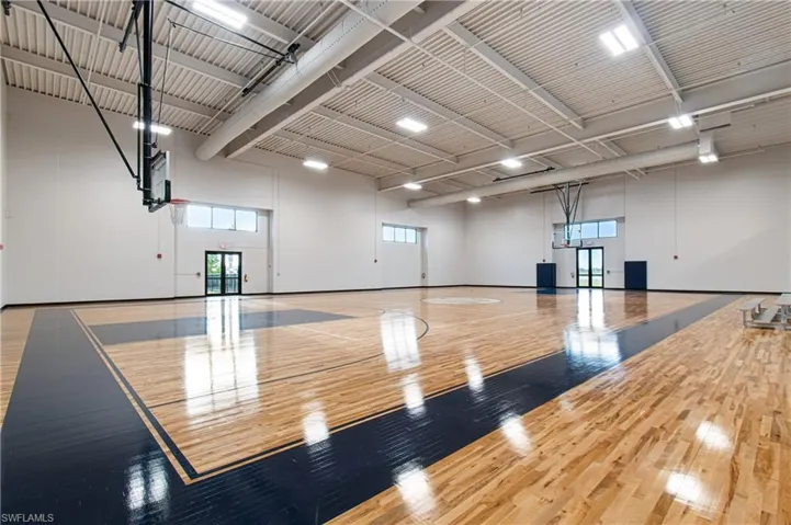 View of basketball court featuring basketball court and plenty of natural light