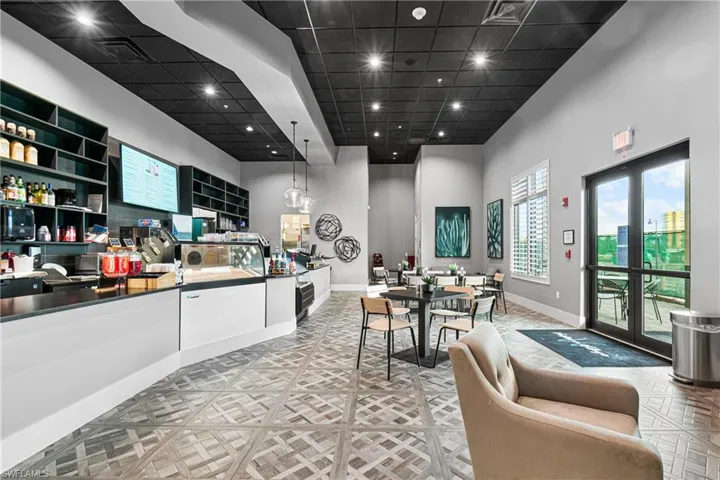 Welcome area featuring a high ceiling and recessed lighting