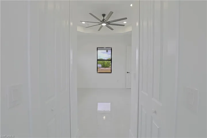 Spare room featuring baseboards, recessed lighting, and a ceiling fan