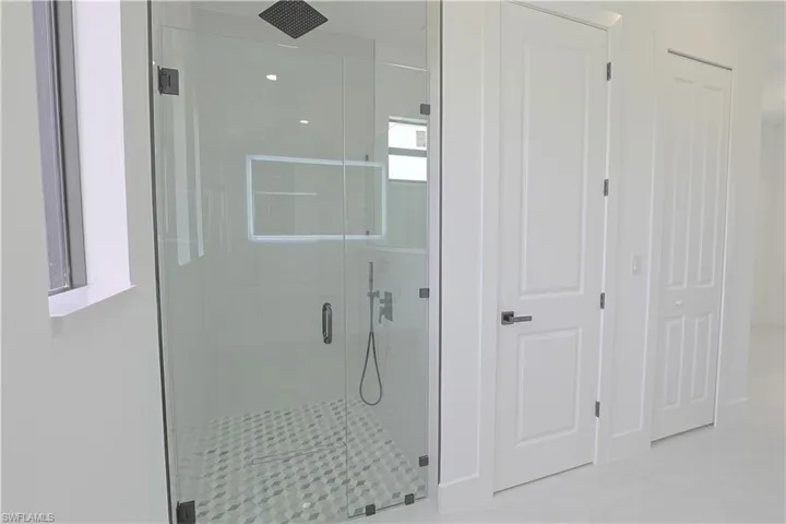 Full bathroom with a stall shower