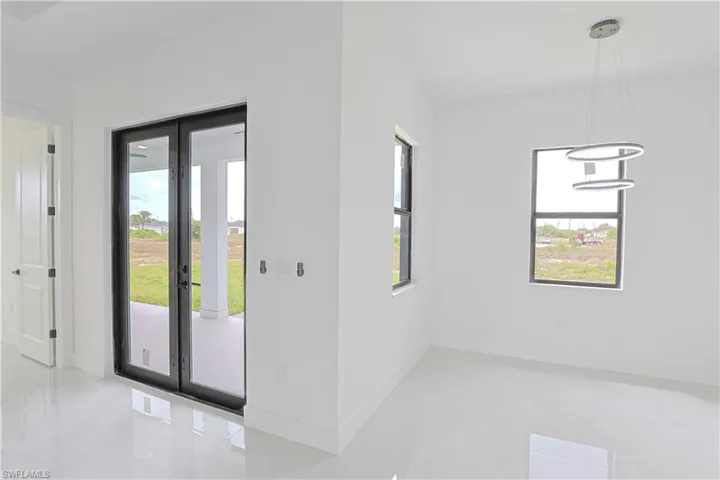 Unfurnished room featuring baseboards
