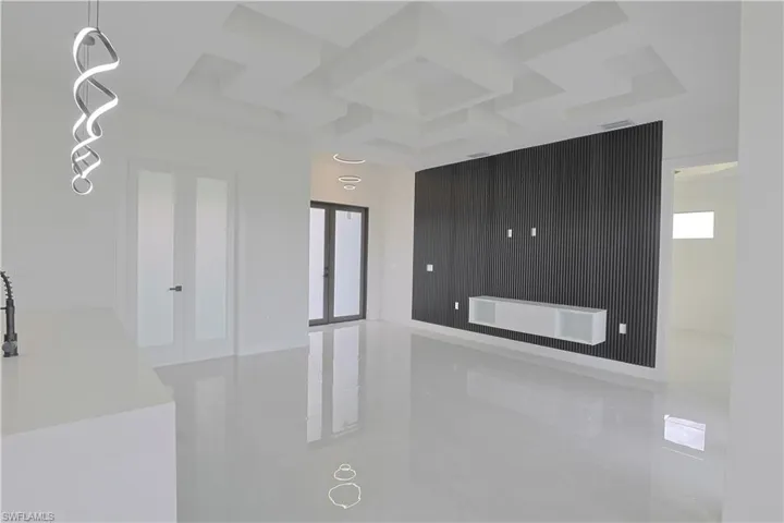 Unfurnished room featuring marble finish floor and french doors