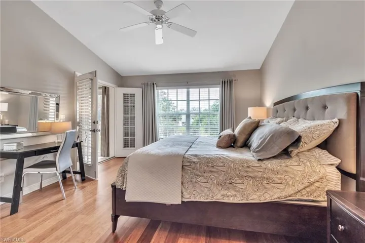 Neutral tones and wood flooring in the master bedroom