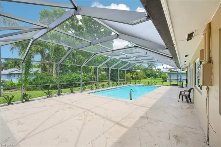 View of 30' x 20' swimming pool with a screened lanai and a patio area