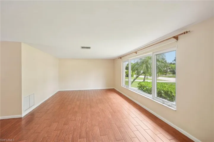 Unfurnished room with light wood-type flooring