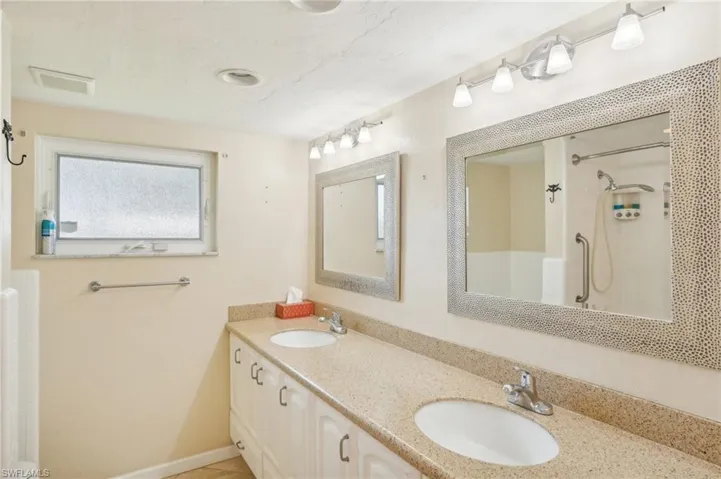 Bathroom with walk in shower and vanity
