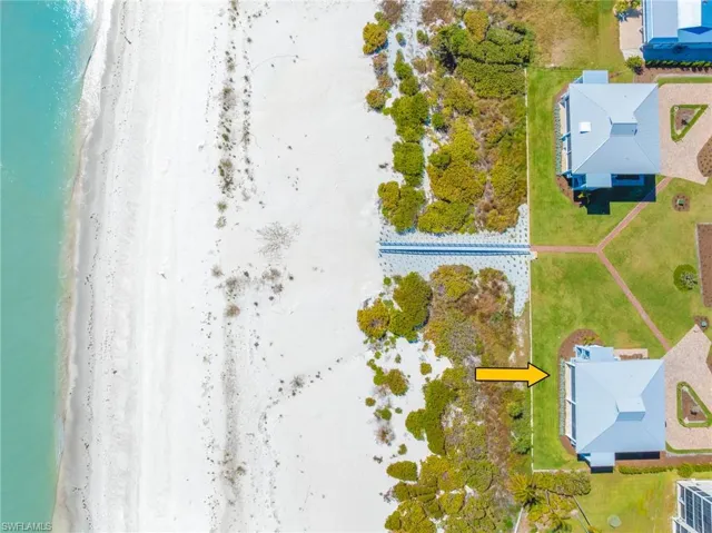 Bird's eye view of waterfront with a beach