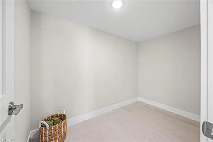 Empty room featuring baseboards