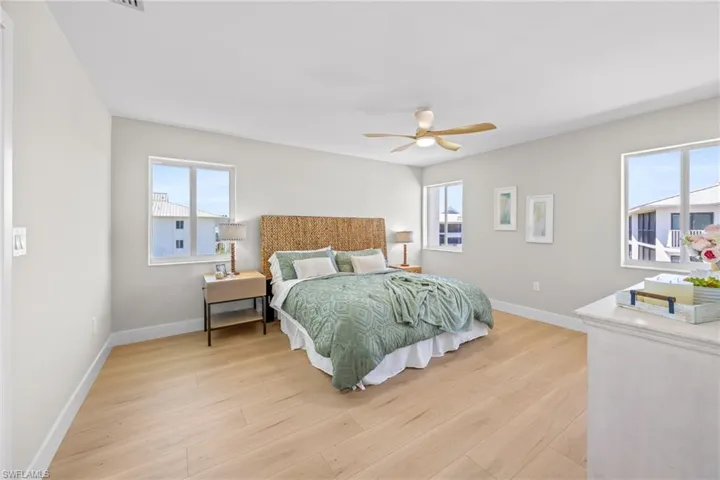 Bedroom featuring light wood-type flooring and a ceiling fan