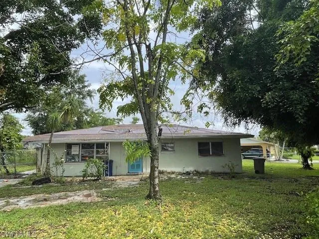 View of front of home featuring a front lawn