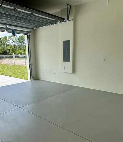 Garage featuring electric panel